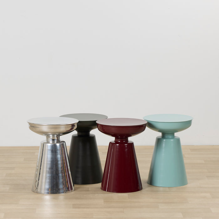 Obelisk Side Table - Wine, glossy wine sculptural side table displayed with chrome, black and mint side tables on timber flooring