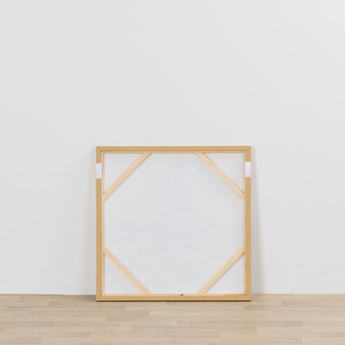 Wooden picture frame on a white wall