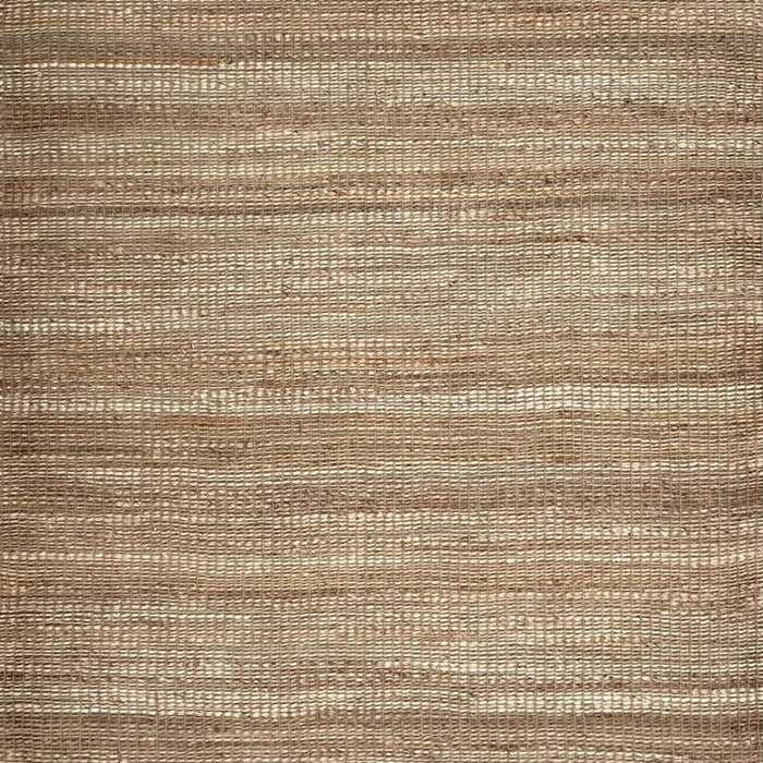 A close-up of a woven natural fiber rug or textile in warm tan and beige tones, showing horizontal ribbed texture.