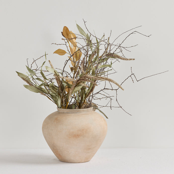 Antique Wide Ornament - Rustic, wide earthy multi-toned decorative ornament styled with dried foliage on a white surface
