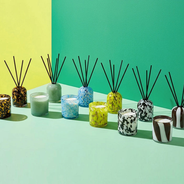 Aurora Diffuser - Sea Mist mottled blue and gold glass reed diffuser styled with colourful home fragrance vessels
