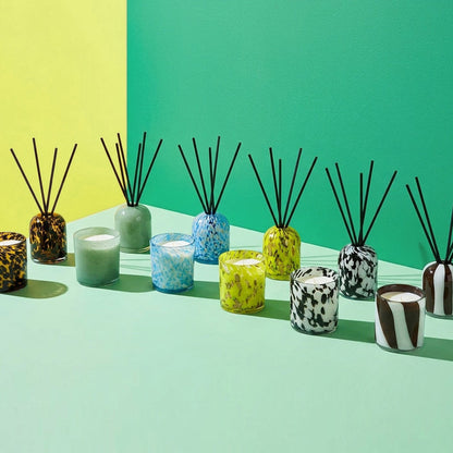 Aurora Diffuser - Sea Mist mottled blue and gold glass reed diffuser styled with colourful home fragrance vessels