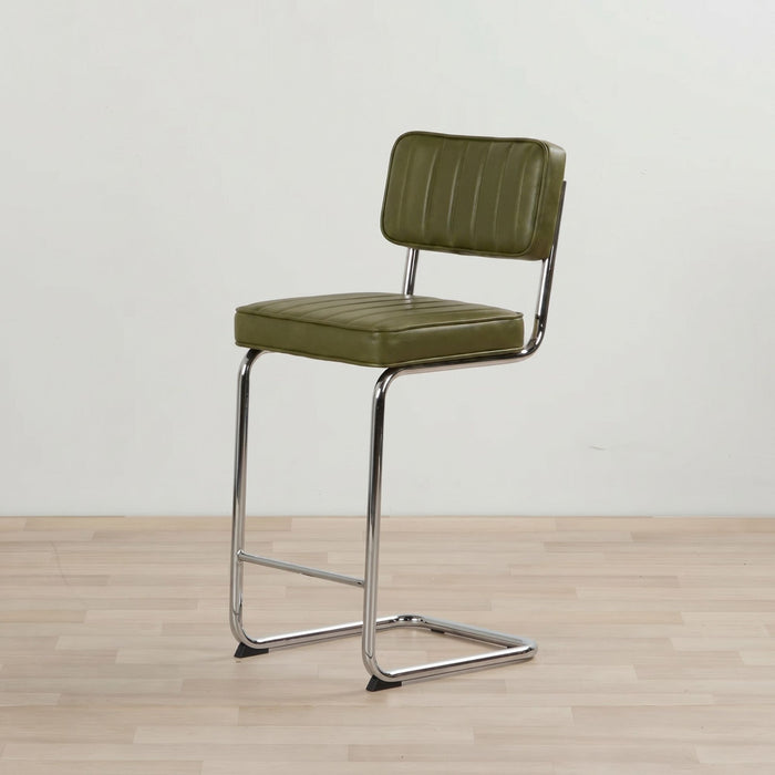 Green bar stool with a metal frame on a wooden floor.
