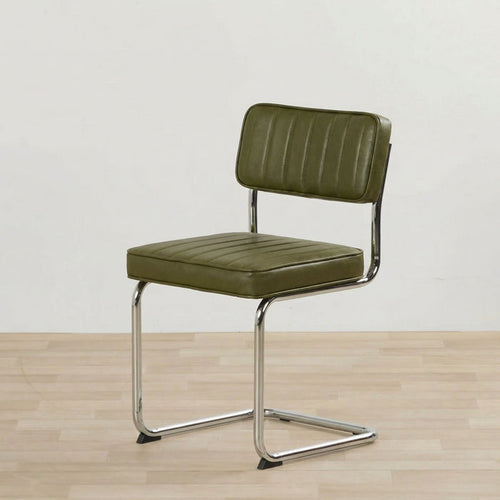 Green bar stool with metal frame on a wooden floor