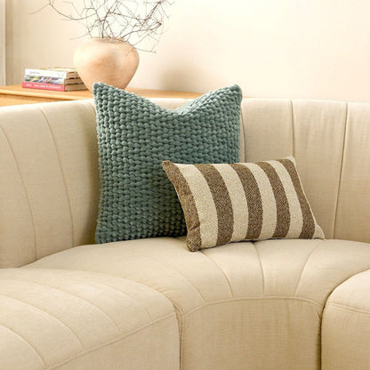 Benton 30x50cm Cushion - Brown Stripe, textured brown and cream striped cushion styled on a curved cream sofa.