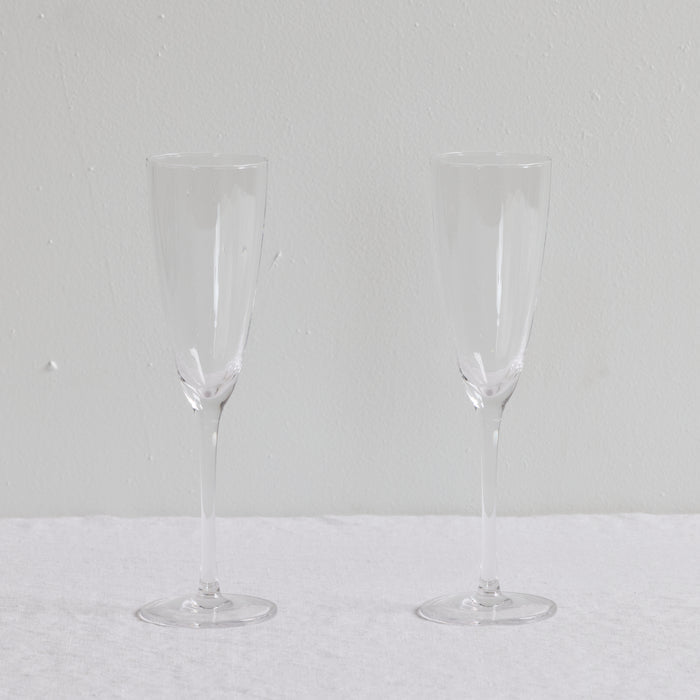 Bravo Champagne Glass Set - 2pc - Clear, two clear champagne flutes with sleek refined silhouettes.