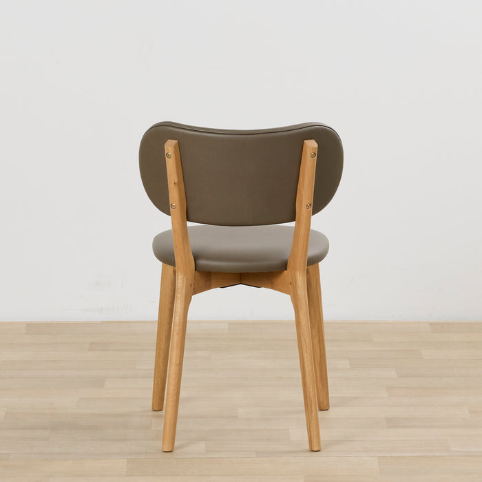 Briar Dining Chair - Oak/Olive, rear view of olive upholstered dining chair with warm oak-toned timber frame on light timber flooring