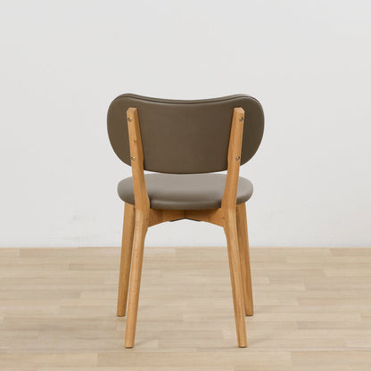 Briar Dining Chair - Oak/Olive, rear view of olive upholstered dining chair with warm oak-toned timber frame on light timber flooring