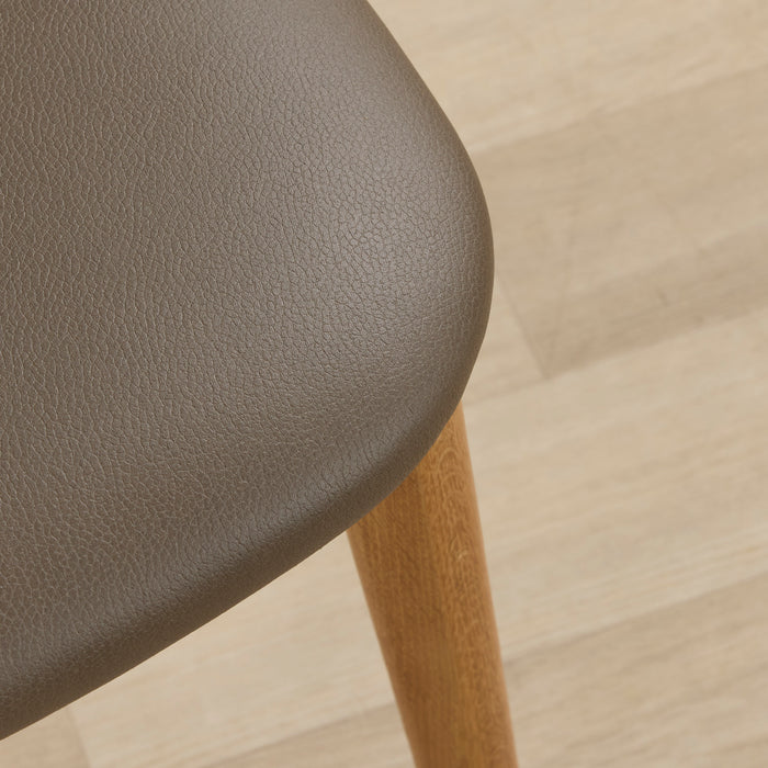 Briar Dining Chair - Oak/Olive close-up of olive upholstered seat and warm oak-toned timber leg