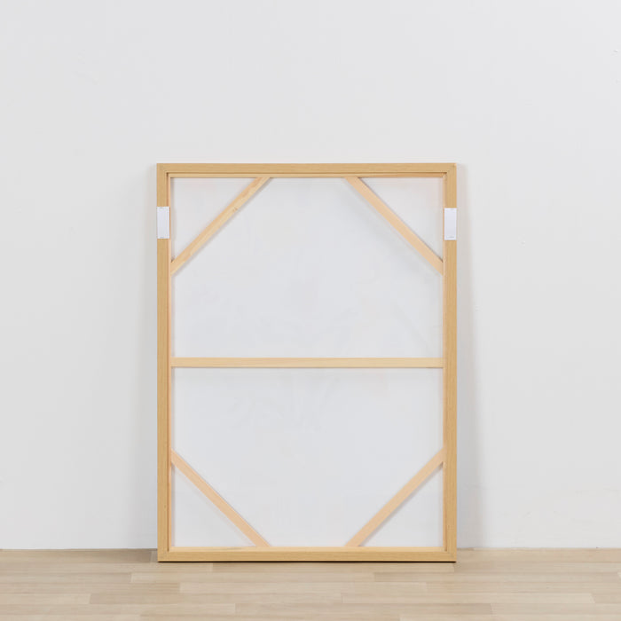 Wooden picture frame on a white wall