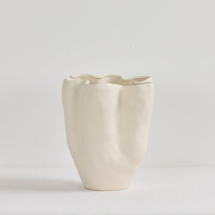 Corolle Vase - Bone, sculptural neutral ceramic vase with soft organic folds and a fluid wavy rim