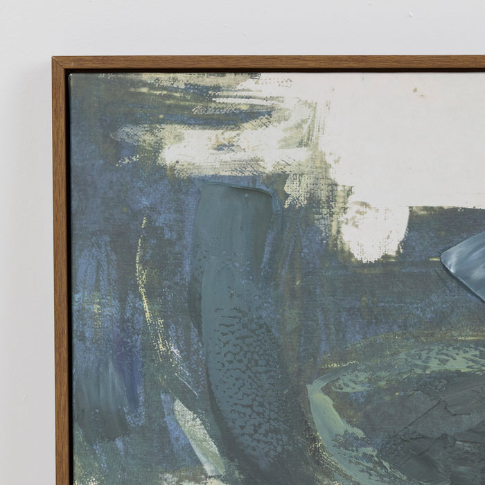 Abstract painting with a wooden frame on a white wall