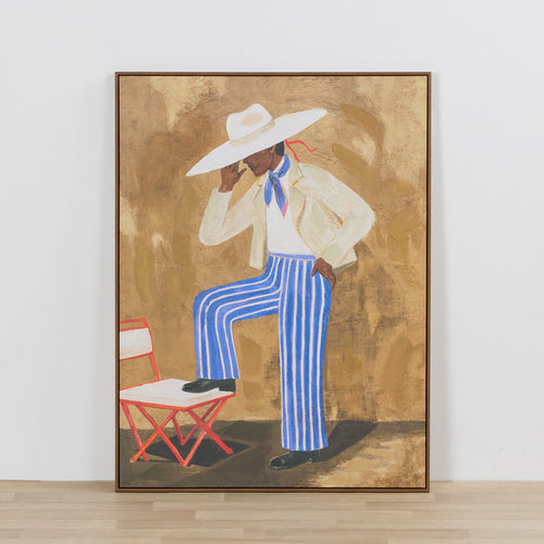 Figure in Stripes Framed Artwork wall art featuring a seated figure in blue striped trousers and a white hat
