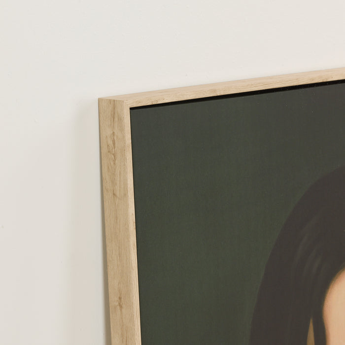 Framed artwork on a wall with a neutral background