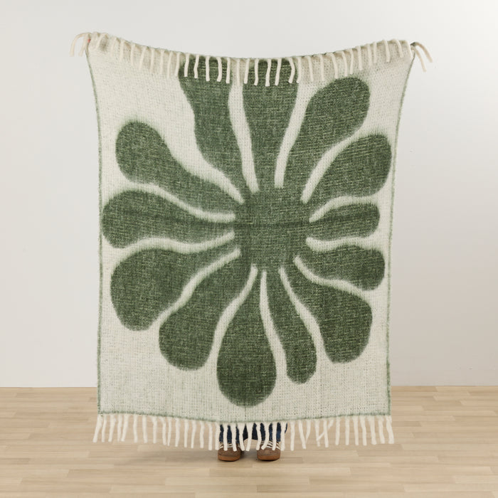 Happy Throw - Green/White thick cosy throw with bold organic green floral pattern and fringed edges.