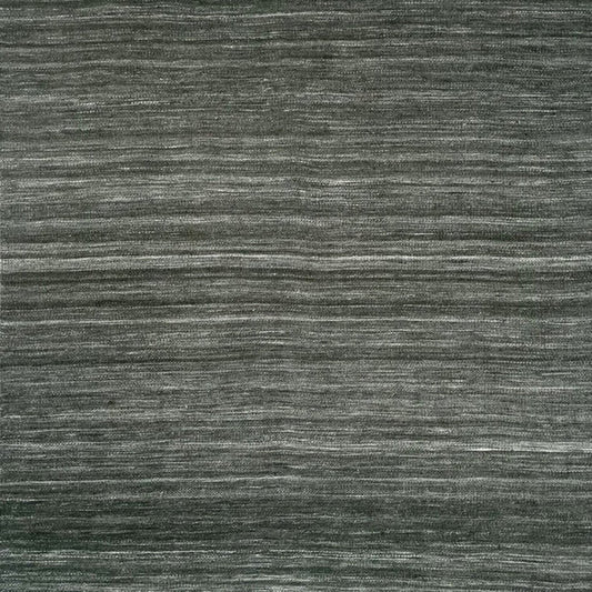 A close-up of a textured woven rug or fabric in dark charcoal gray with subtle horizontal tonal variation and white fringe along the top and bottom edges.