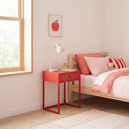 Small bedroom with a red nightstand, bed with pink bedding, and apple artwork on the wall.