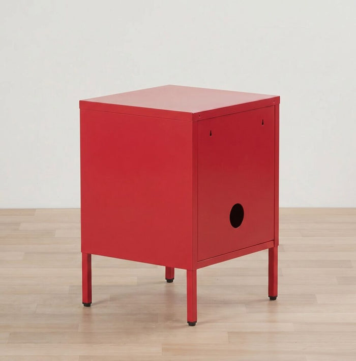 Red nightstand on a wooden floor with a white wall background