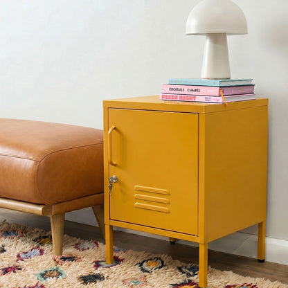 Yellow metal cabinet with books and a lamp on top, next to a brown leather ottoman on a patterned rug.
