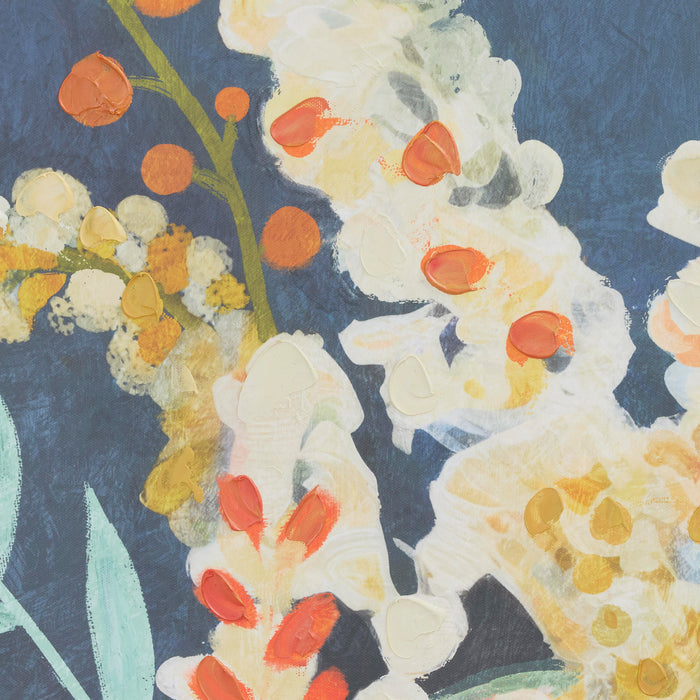 Close-up of a floral pattern with white, orange, and yellow flowers on a dark blue background.
