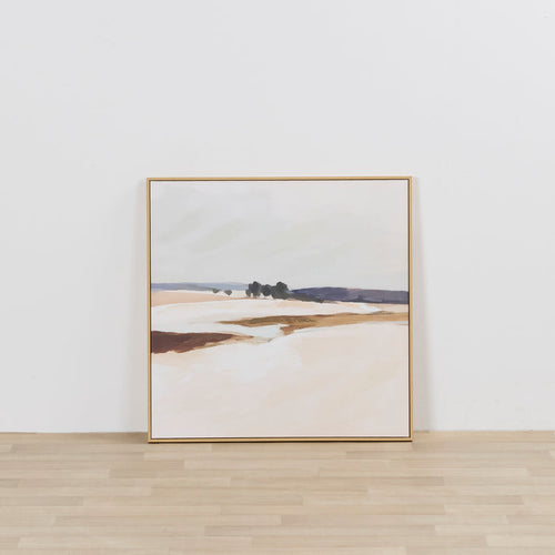 Framed landscape painting on a white wall