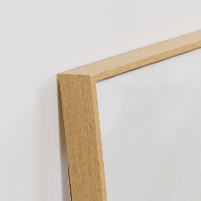 Close-up of a wooden picture frame on a white background