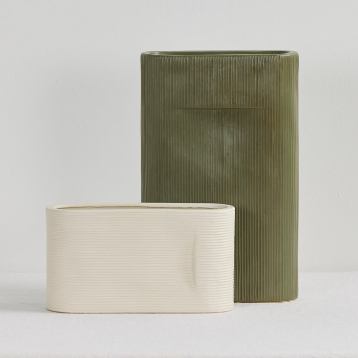 Linea Low Vase - Bone, low wide ribbed vase in a neutral bone finish, styled beside a taller green vase