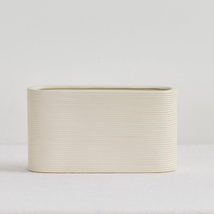 Linea Low Vase - Bone, low wide ribbed ceramic vase in a soft neutral bone finish
