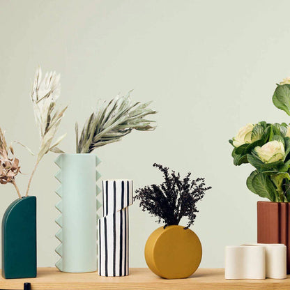 Little Round Vase - Yellow, small round ceramic vase styled with dark dried foliage on a timber surface