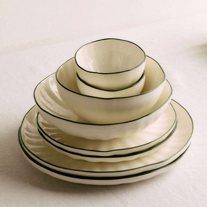 Lotus Snack Bowl - White/Green, white dinnerware bowl with a fine green rim, stacked with matching plates and bowls