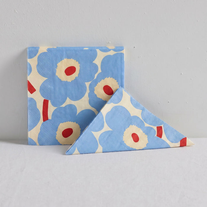 Marimekko Paper Napkin - 20pc - Cream/Blue featuring cream and blue Unikko poppies with red centres, folded beside packet
