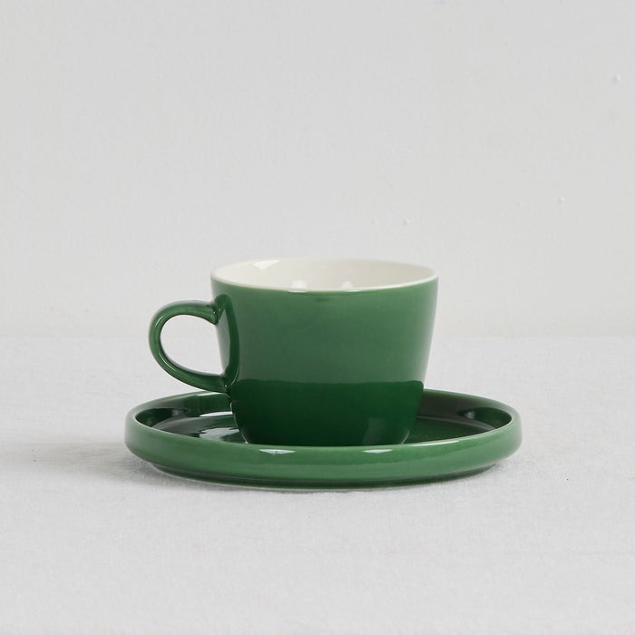 Mesa Coffee Cup & Saucer - Green glossy green dinnerware set with a white interior and matching saucer.