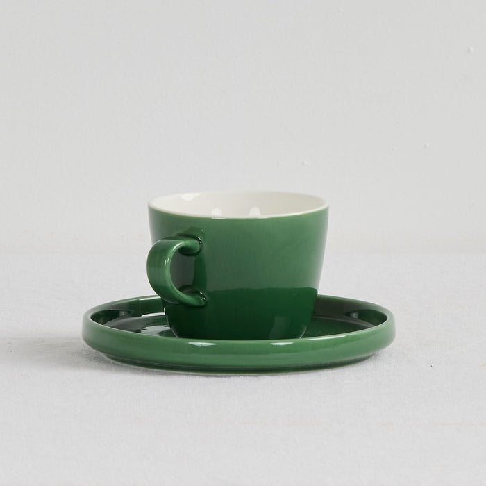Mesa Coffee Cup & Saucer - Green, glossy green dinnerware with a white interior and matching saucer.