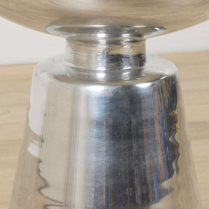 Obelisk Side Table - Chrome, close-up of polished chrome sculptural pedestal base beneath a round tabletop