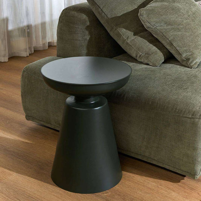 Obelisk Side Table - Olive Green, sculptural side table with round tray top beside an olive sofa on timber flooring