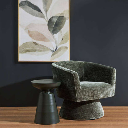Obelisk Side Table - Olive Green, sculptural olive side table beside a green velvet armchair and botanical wall art