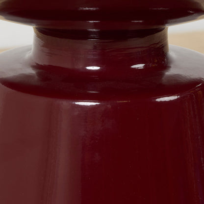 Obelisk Side Table - Wine, close-up of glossy wine-red sculptural pedestal and round tray tabletop