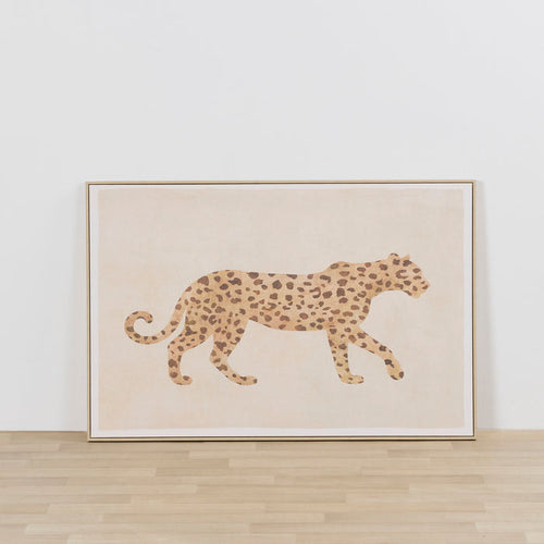 On The Prowl Framed Artwork featuring a spotted leopard silhouette in warm neutral tones, leaning against a white wall