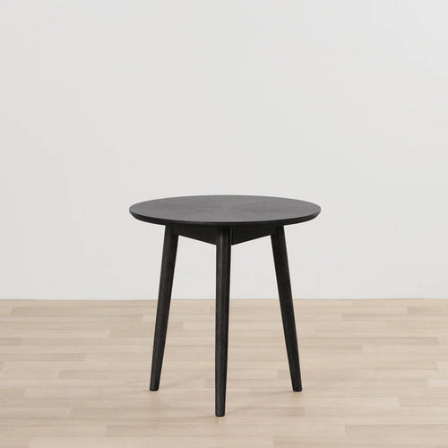 Orlando Large Side Table - Black round black side table with tapered legs on a light timber floor