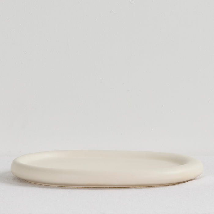 Pebble Large Tray - Bone, a low oval bone-coloured serveware tray with softly rounded edges.