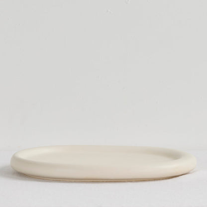 Pebble Large Tray - Bone, a low oval bone-coloured serveware tray with softly rounded edges.