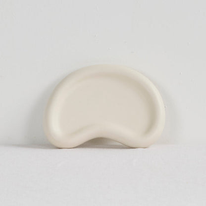 Pebble Small Tray - Bone, small bone-coloured tray with a softly raised rim and organic pebble shape