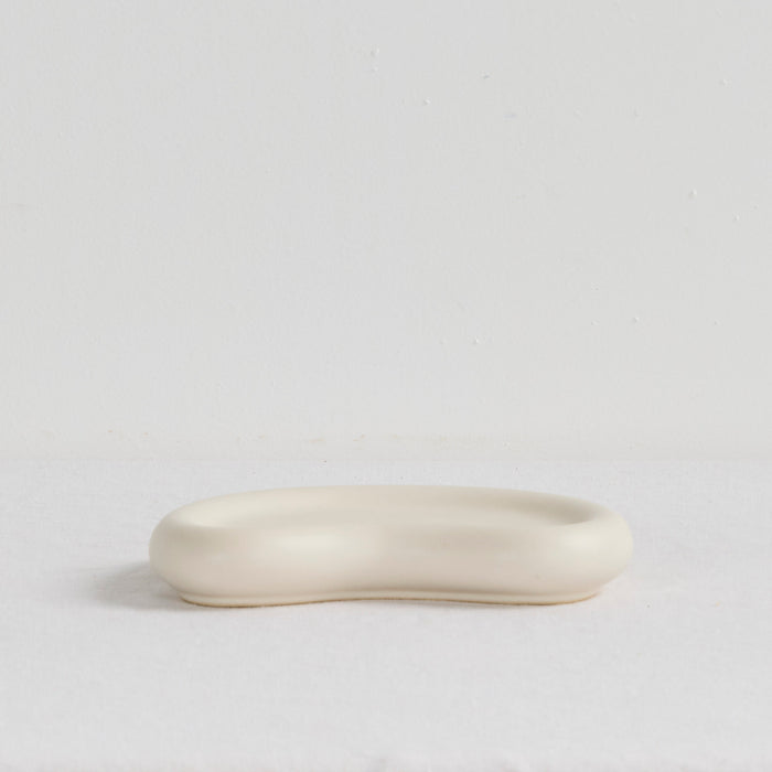 Pebble Small Tray - Bone, small organic-shaped bone tray with a softly raised rim and smooth matte finish