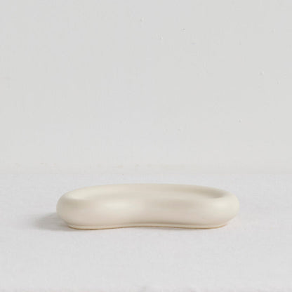 Pebble Small Tray - Bone, small organic-shaped bone tray with a softly raised rim and smooth matte finish