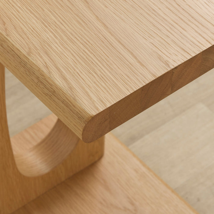 Samson End Table - Oak close-up of rounded oak tabletop edge, natural wood grain and sculptural curved base