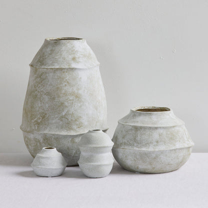 Sculptural Mini Ornament - Cement, small handcrafted stoneware ornament with a tiered textured finish, styled with matching vessels