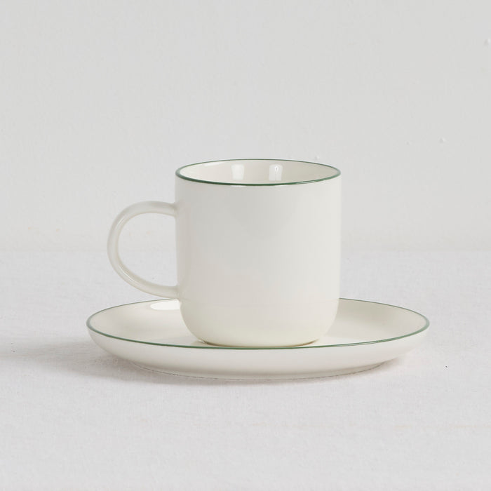 Soma Coffee Cup & Saucer - White/Green white dinnerware set with fine green rim detailing and rounded handle.