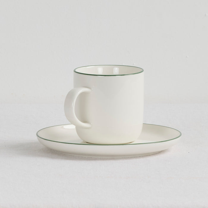 Soma Coffee Cup & Saucer - White/Green white dinnerware set with fine green rim detailing.