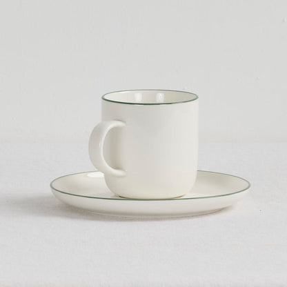 Soma Coffee Cup & Saucer - White/Green white dinnerware set with fine green rim detailing.