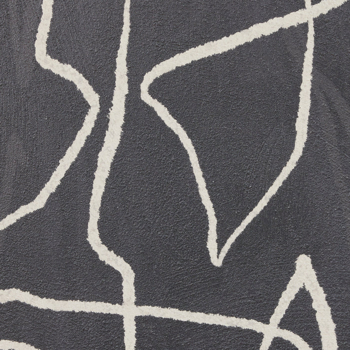 Close-up of a textured surface with white abstract line patterns on a dark background